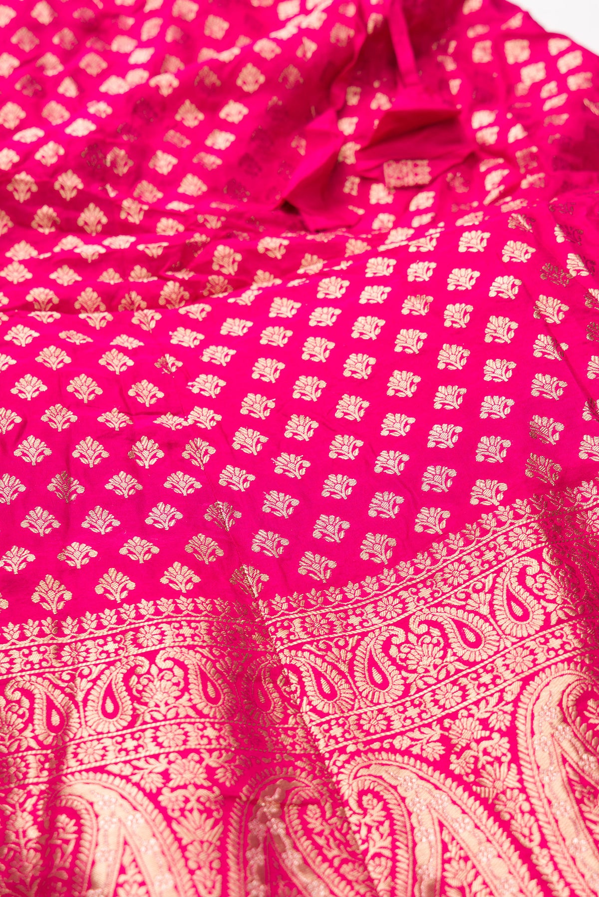Detailed shot of Dark Pink Banarasi Silk Womens Lehenga set featuring Zari Brocade Choli paired with Dark Pink Zari Brocade Skirt with Zari Border and a Zari Butta dupatta in Dark Pink