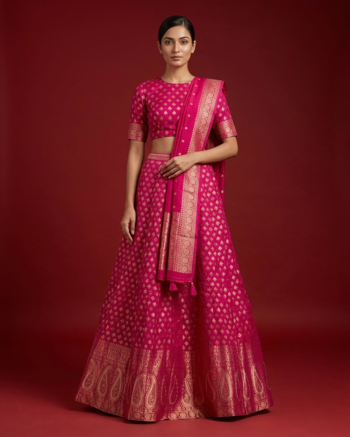 Dark Pink Banarasi Silk Womens Lehenga set featuring Zari Brocade Choli paired with Dark Pink Zari Brocade Skirt with Zari Border and a Zari Butta dupatta in Dark Pink