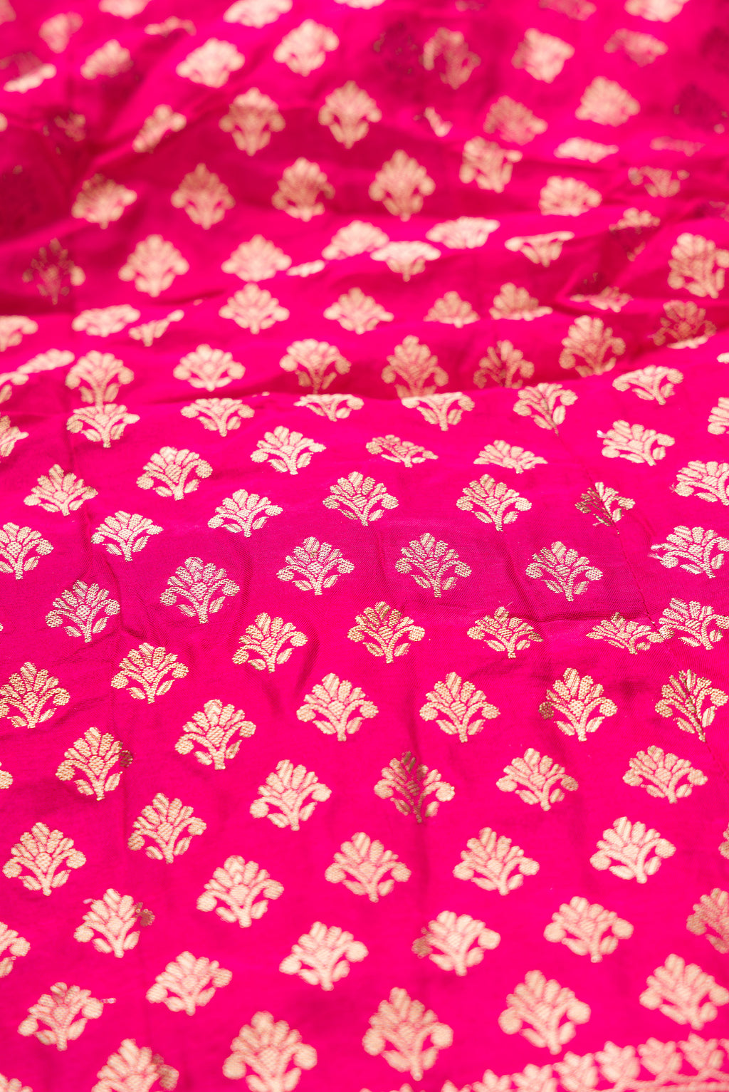 Close up blouse image of Dark Pink Banarasi Silk Womens Lehenga set featuring Zari Brocade Choli paired with Dark Pink Zari Brocade Skirt with Zari Border and a Zari Butta dupatta in Dark Pink