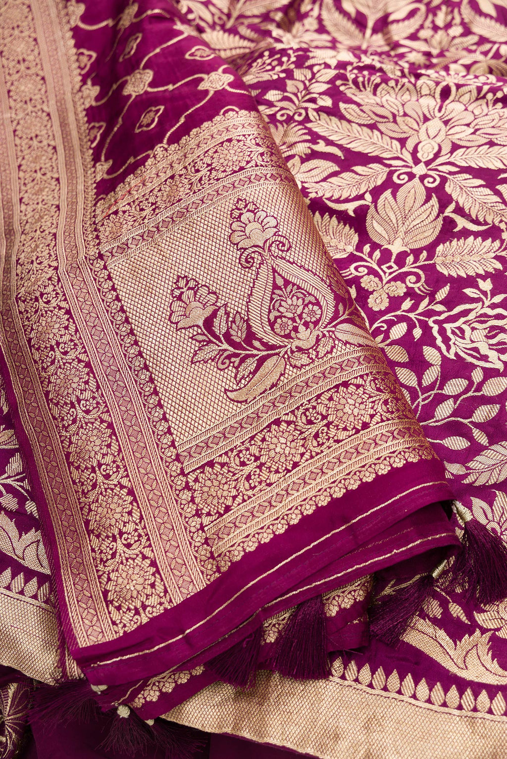 Detailed shot of Magenta Banarasi Silk Womens Lehenga set featuring Zari Brocade Choli paired with Magenta Zari Brocade Skirt with Zari Border and a Zari Butta dupatta in Magenta
