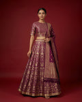 Magenta Banarasi Silk Womens Lehenga set featuring Zari Brocade Choli paired with Magenta Zari Brocade Skirt with Zari Border and a Zari Butta dupatta in Magenta