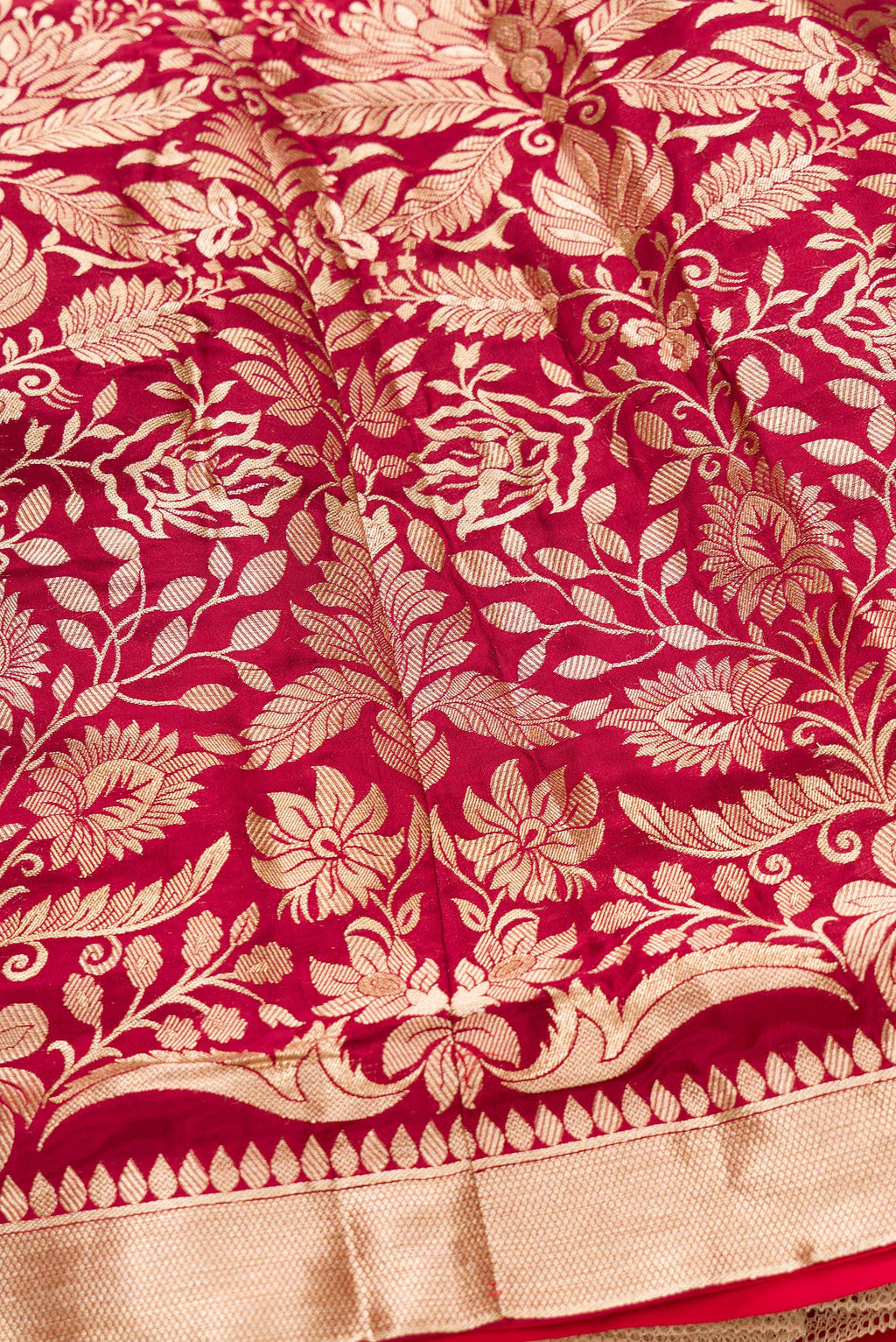 Detailed shot of Imperial Red Banarasi Silk Womens Lehenga set featuring Zari Brocade Choli paired with Imperial Red Zari Brocade Skirt with Zari Border and a Zari Butta dupatta in Imperial Red