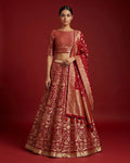 Imperial Red Banarasi Silk Womens Lehenga set featuring Zari Brocade Choli paired with Imperial Red Zari Brocade Skirt with Zari Border and a Zari Butta dupatta in Imperial Red