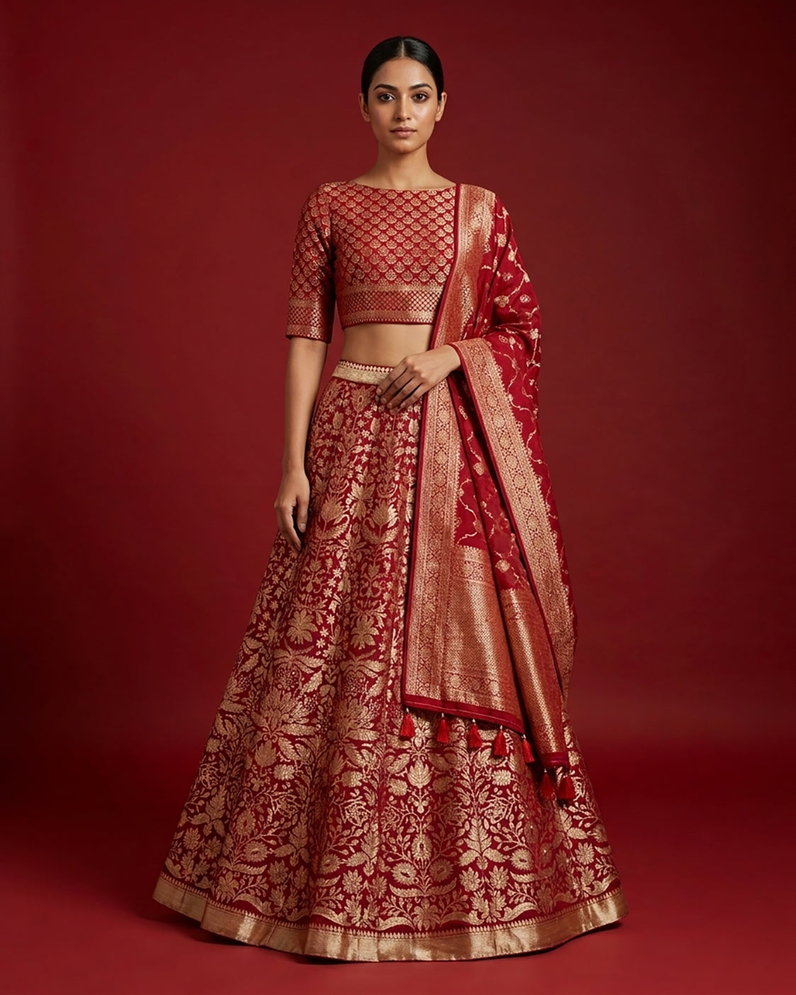 Imperial Red Banarasi Silk Womens Lehenga set featuring Zari Brocade Choli paired with Imperial Red Zari Brocade Skirt with Zari Border and a Zari Butta dupatta in Imperial Red