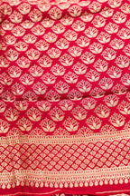 Close up blouse image of Imperial Red Banarasi Silk Womens Lehenga set featuring Zari Brocade Choli paired with Imperial Red Zari Brocade Skirt with Zari Border and a Zari Butta dupatta in Imperial Red