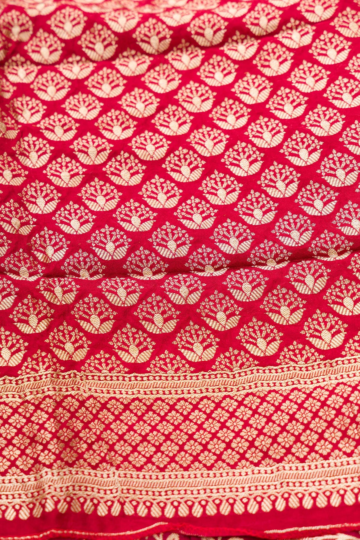 Close up blouse image of Imperial Red Banarasi Silk Womens Lehenga set featuring Zari Brocade Choli paired with Imperial Red Zari Brocade Skirt with Zari Border and a Zari Butta dupatta in Imperial Red