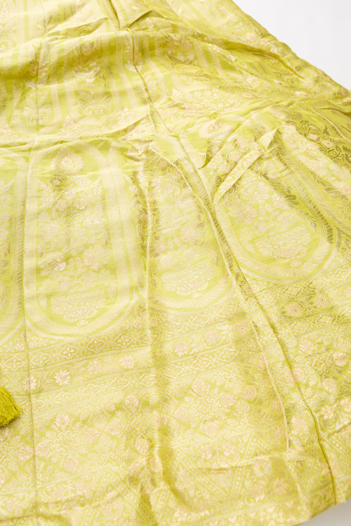 Detailed shot of Light Green Banarasi Silk Womens Lehenga set featuring Zari Brocade Choli paired with Light Green Zari Brocade Skirt with Zari Border and a Zari Butta dupatta in Light Green