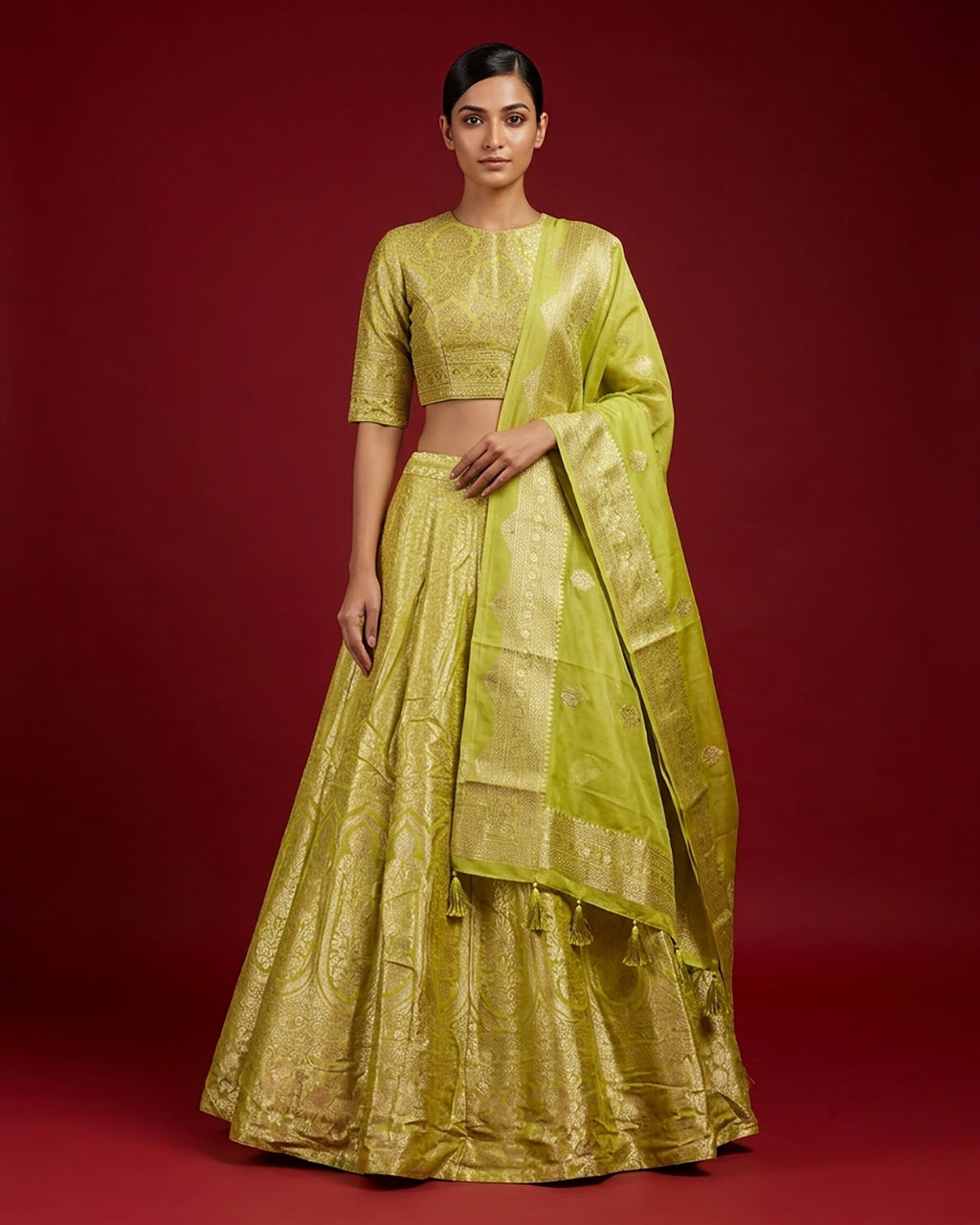 Light Green Banarasi Silk Womens Lehenga set featuring Zari Brocade Choli paired with Light Green Zari Brocade Skirt with Zari Border and a Zari Butta dupatta in Light Green
