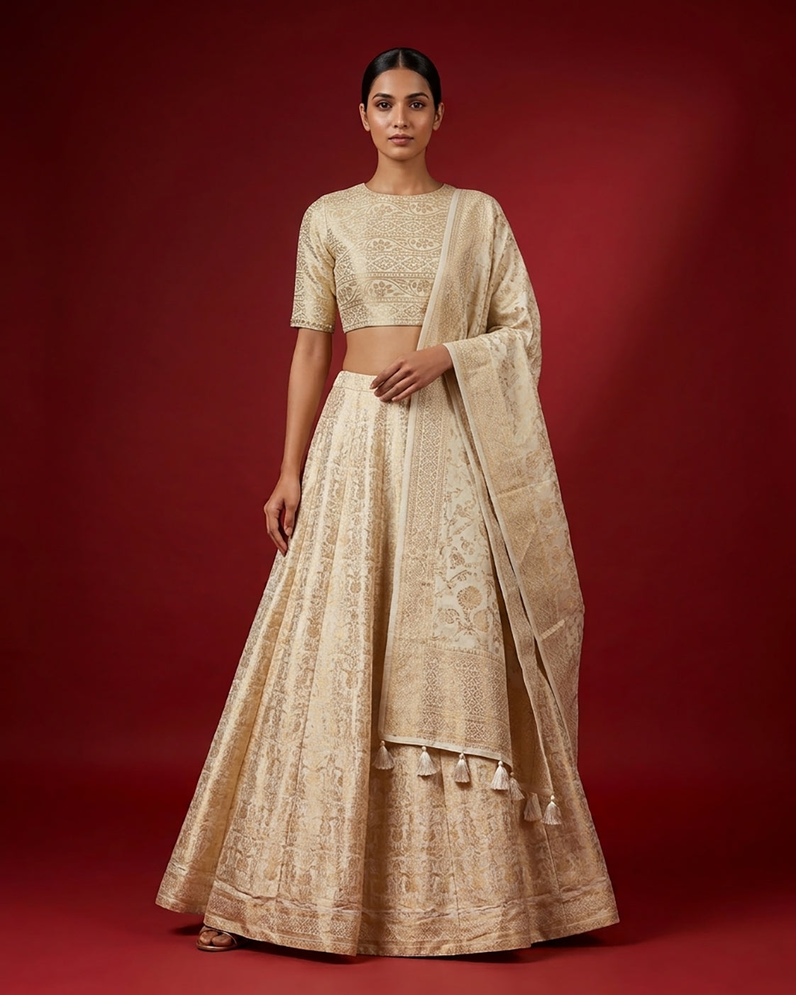 Sandal Banarasi Silk Womens Lehenga set featuring Zari Brocade Choli paired with Sandal Zari Brocade Skirt with Zari Border and a Zari Brocade dupatta in Sandal