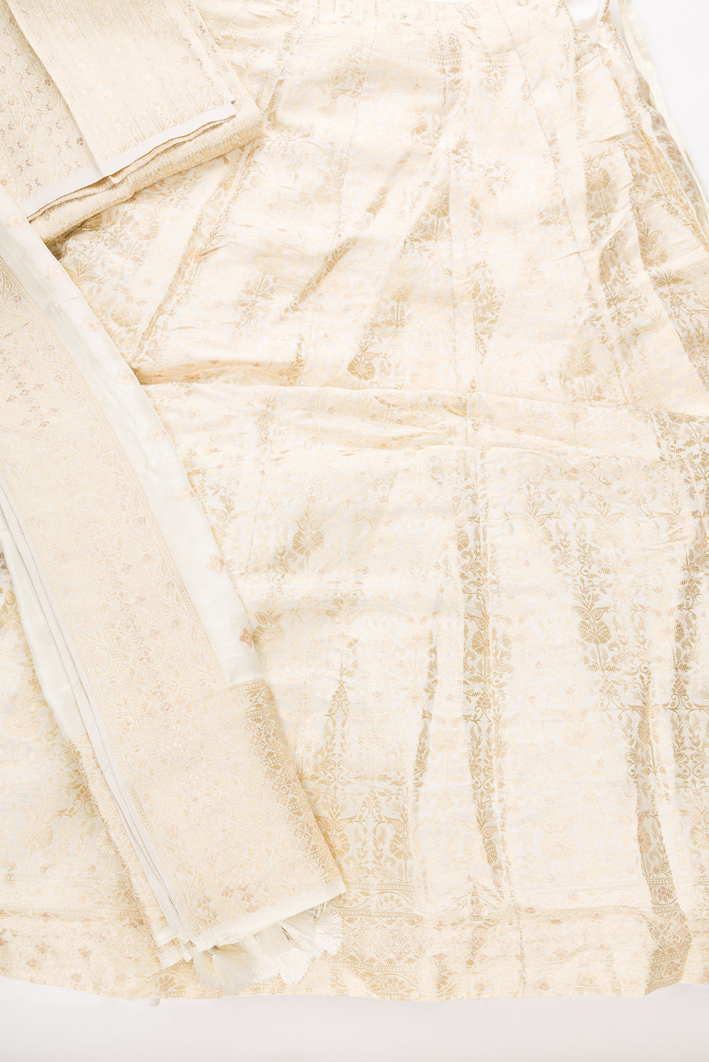 Flat lay of Sandal Banarasi Silk Womens Lehenga set featuring Zari Brocade Choli paired with Sandal Zari Brocade Skirt with Zari Border and a Zari Brocade dupatta in Sandal