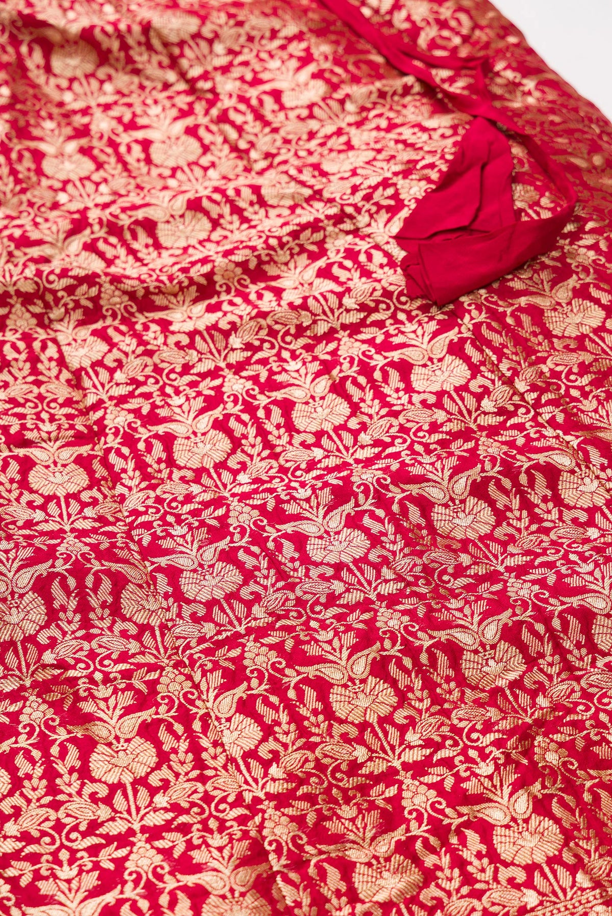 Detailed shot of Imperial Pink Banarasi Silk Womens Lehenga set featuring Zari Brocade Choli paired with Imperial Pink Zari Brocade Skirt with Zari Border and a Zari Butta dupatta in Imperial Pink