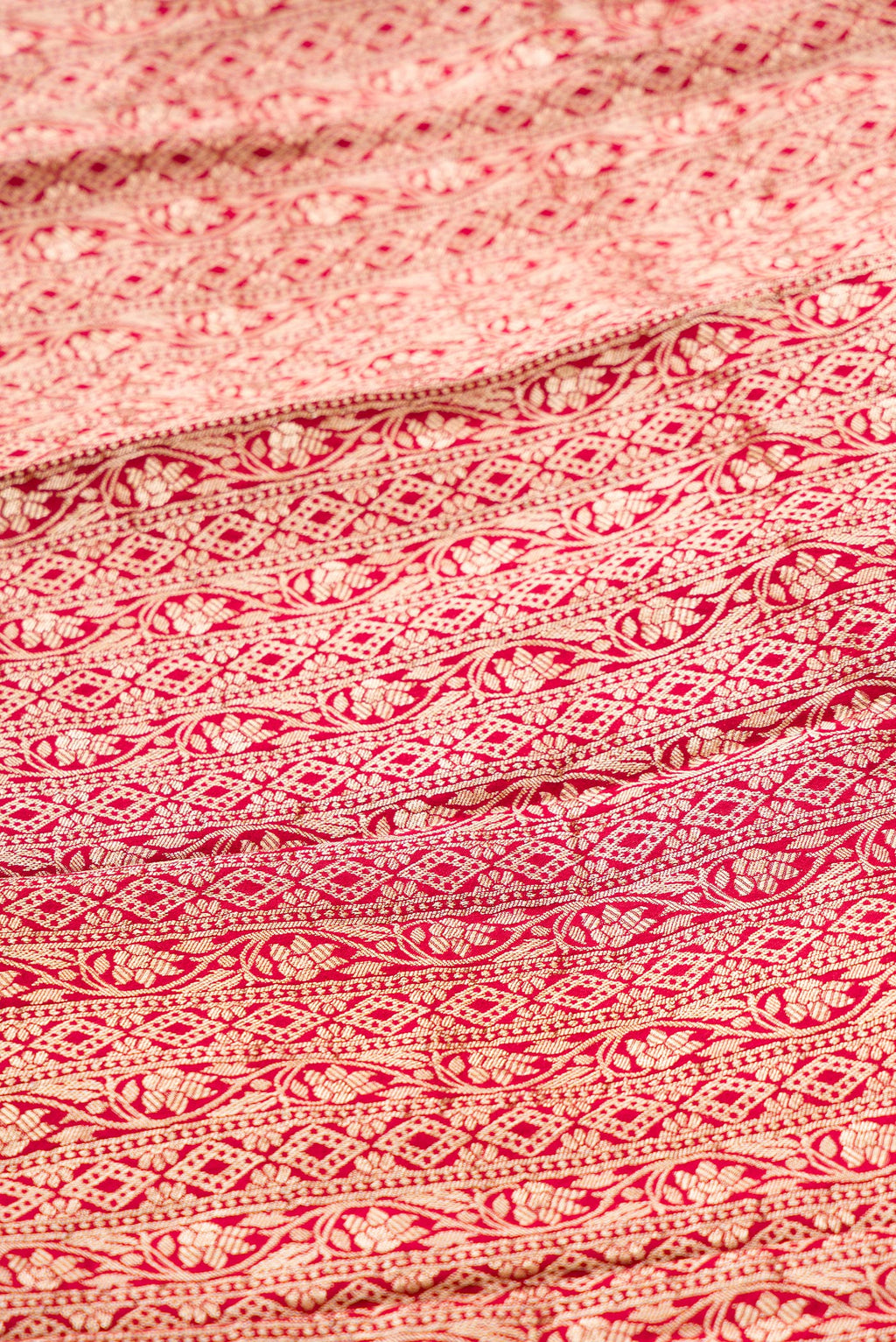 Close up blouse image of Imperial Pink Banarasi Silk Womens Lehenga set featuring Zari Brocade Choli paired with Imperial Pink Zari Brocade Skirt with Zari Border and a Zari Butta dupatta in Imperial Pink