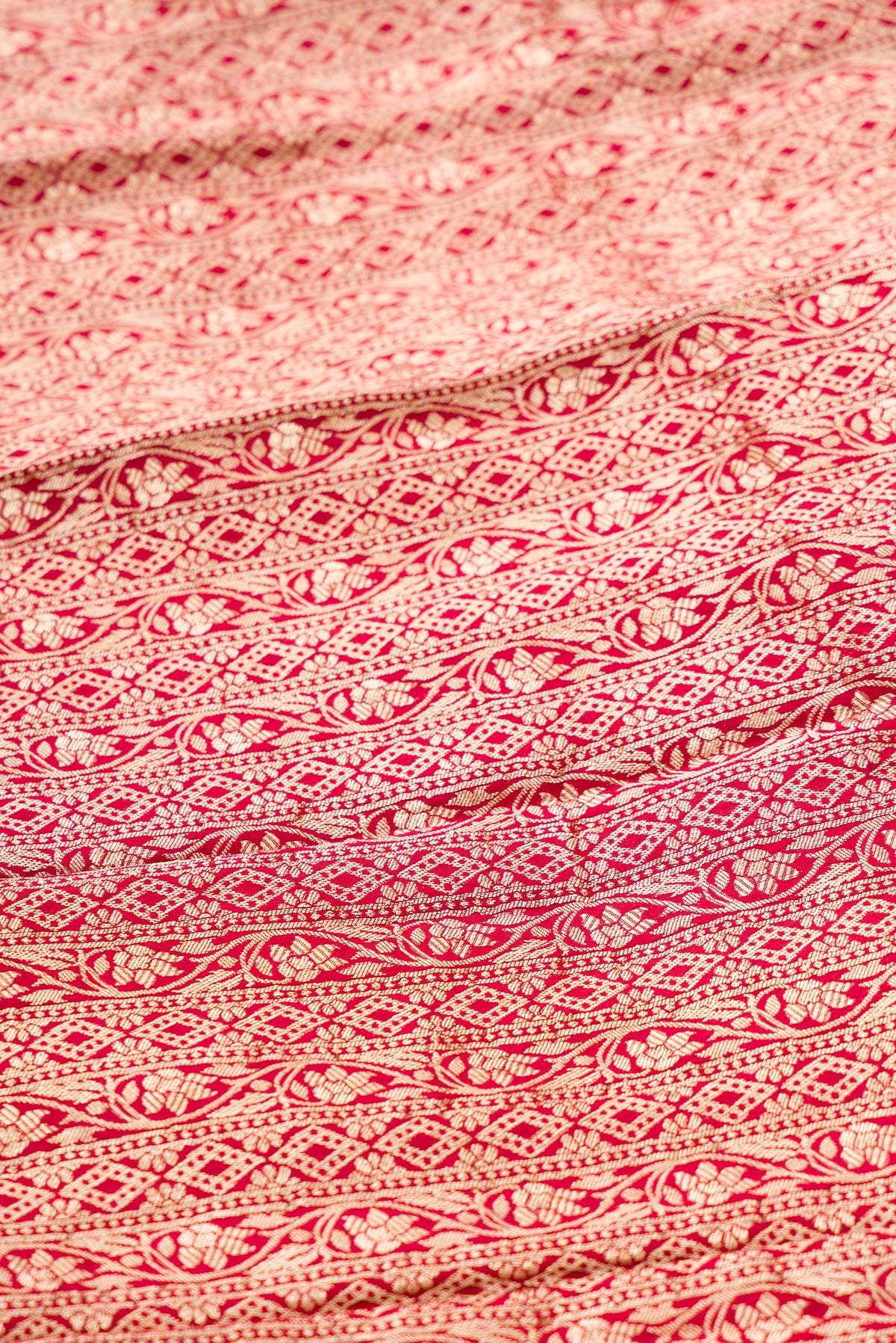 Close up blouse image of Imperial Pink Banarasi Silk Womens Lehenga set featuring Zari Brocade Choli paired with Imperial Pink Zari Brocade Skirt with Zari Border and a Zari Butta dupatta in Imperial Pink