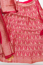 Flat lay of Imperial Pink Banarasi Silk Womens Lehenga set featuring Zari Brocade Choli paired with Imperial Pink Zari Brocade Skirt with Zari Border and a Zari Butta dupatta in Imperial Pink