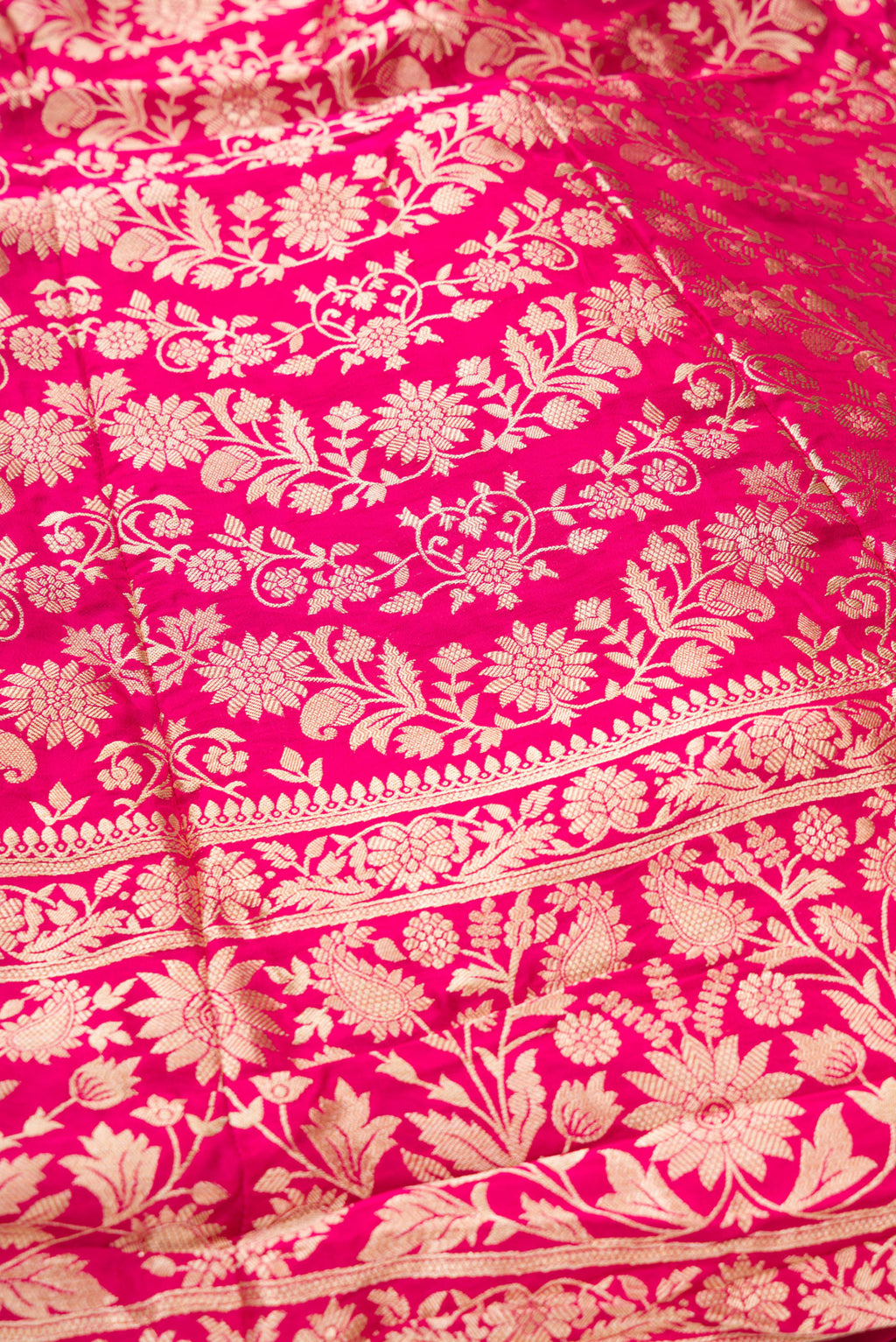 Detailed shot of Dark Pink Banarasi Silk Womens Lehenga set featuring Zari Brocade Choli paired with Dark Pink Zari Brocade Skirt with Zari Border and a Zari Butta dupatta in Dark Pink