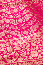 Detailed shot of Dark Pink Banarasi Silk Womens Lehenga set featuring Zari Brocade Choli paired with Dark Pink Zari Brocade Skirt with Zari Border and a Zari Butta dupatta in Dark Pink