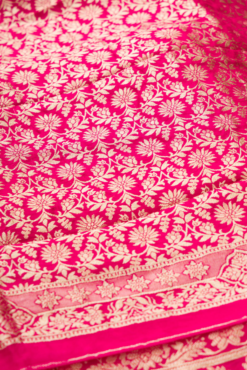 Close up blouse image of Dark Pink Banarasi Silk Womens Lehenga set featuring Zari Brocade Choli paired with Dark Pink Zari Brocade Skirt with Zari Border and a Zari Butta dupatta in Dark Pink