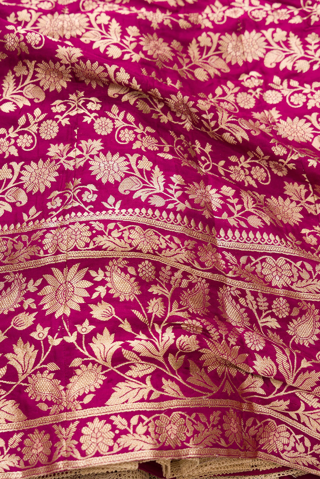 Detailed shot of Magenta Banarasi Silk Womens Lehenga set featuring Zari Brocade Choli paired with Magenta Zari Brocade Skirt with Zari Border and a Zari Butta dupatta in Magenta