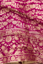 Detailed shot of Magenta Banarasi Silk Womens Lehenga set featuring Zari Brocade Choli paired with Magenta Zari Brocade Skirt with Zari Border and a Zari Butta dupatta in Magenta