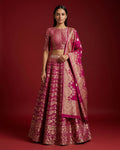 Magenta Banarasi Silk Womens Lehenga set featuring Zari Brocade Choli paired with Magenta Zari Brocade Skirt with Zari Border and a Zari Butta dupatta in Magenta