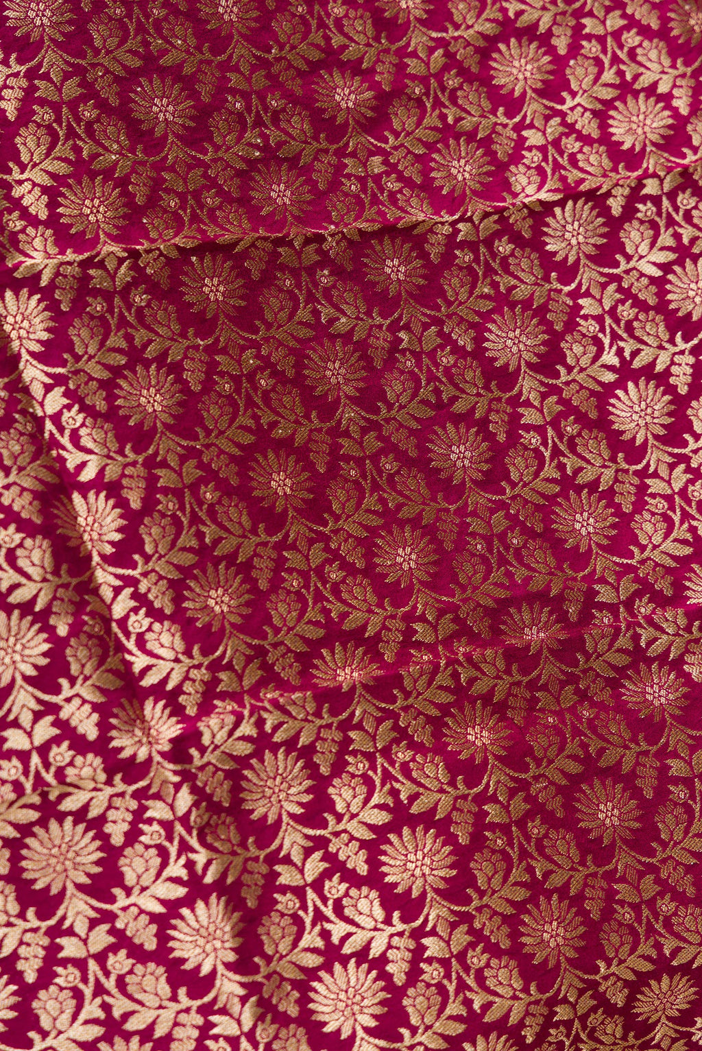 Close up blouse image of Magenta Banarasi Silk Womens Lehenga set featuring Zari Brocade Choli paired with Magenta Zari Brocade Skirt with Zari Border and a Zari Butta dupatta in Magenta