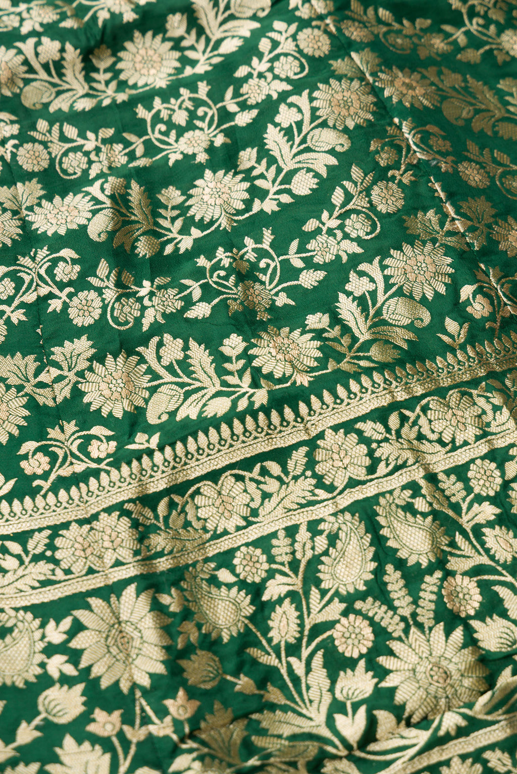 Detailed shot of Green Banarasi Silk Womens Lehenga set featuring Zari Brocade Choli paired with Green Zari Brocade Skirt with Zari Border and a Zari Butta dupatta in Green