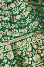 Detailed shot of Green Banarasi Silk Womens Lehenga set featuring Zari Brocade Choli paired with Green Zari Brocade Skirt with Zari Border and a Zari Butta dupatta in Green
