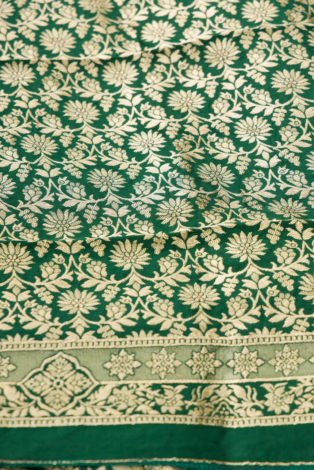 Close up blouse image of Green Banarasi Silk Womens Lehenga set featuring Zari Brocade Choli paired with Green Zari Brocade Skirt with Zari Border and a Zari Butta dupatta in Green