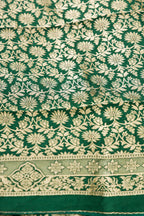 Close up blouse image of Green Banarasi Silk Womens Lehenga set featuring Zari Brocade Choli paired with Green Zari Brocade Skirt with Zari Border and a Zari Butta dupatta in Green