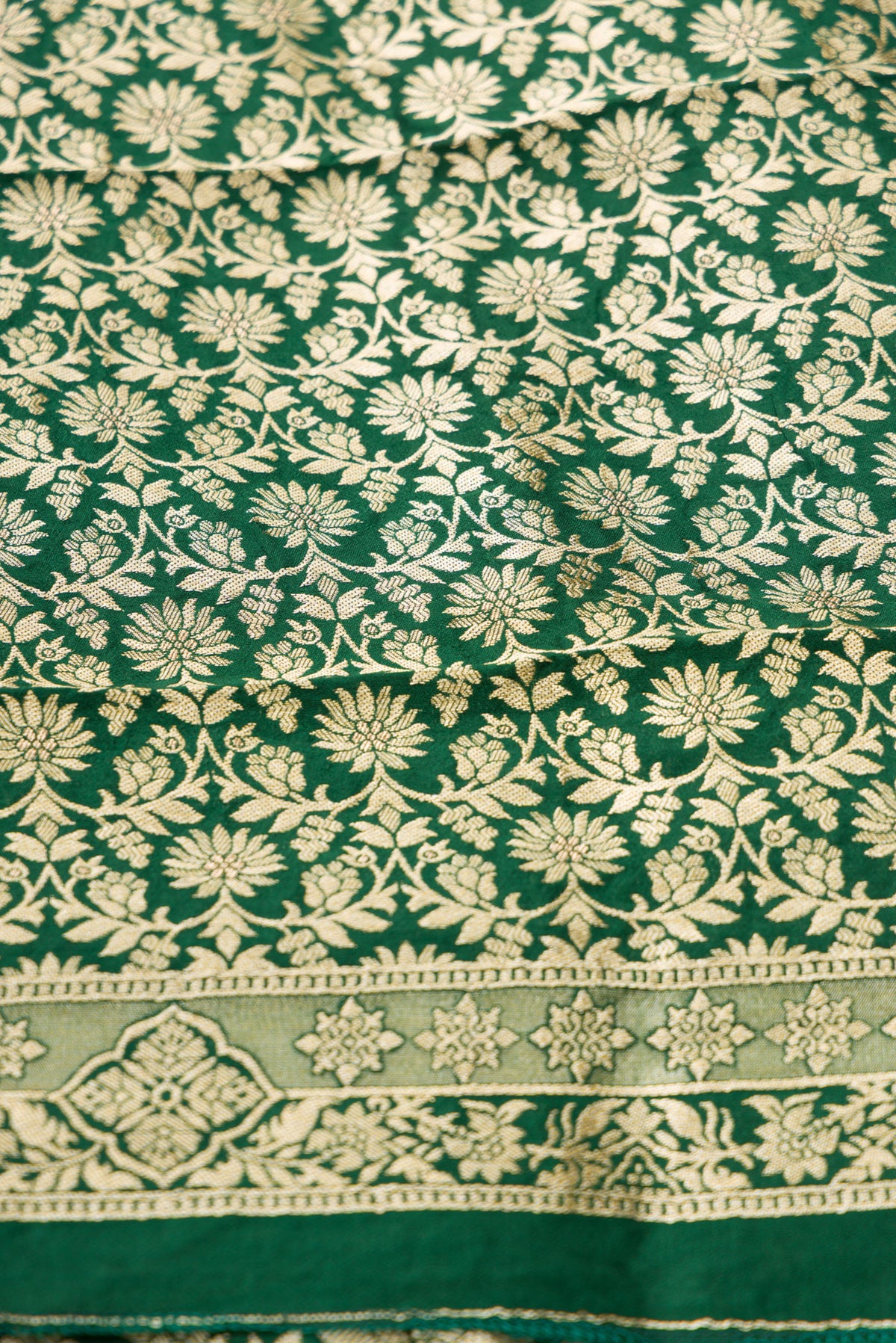Close up blouse image of Green Banarasi Silk Womens Lehenga set featuring Zari Brocade Choli paired with Green Zari Brocade Skirt with Zari Border and a Zari Butta dupatta in Green