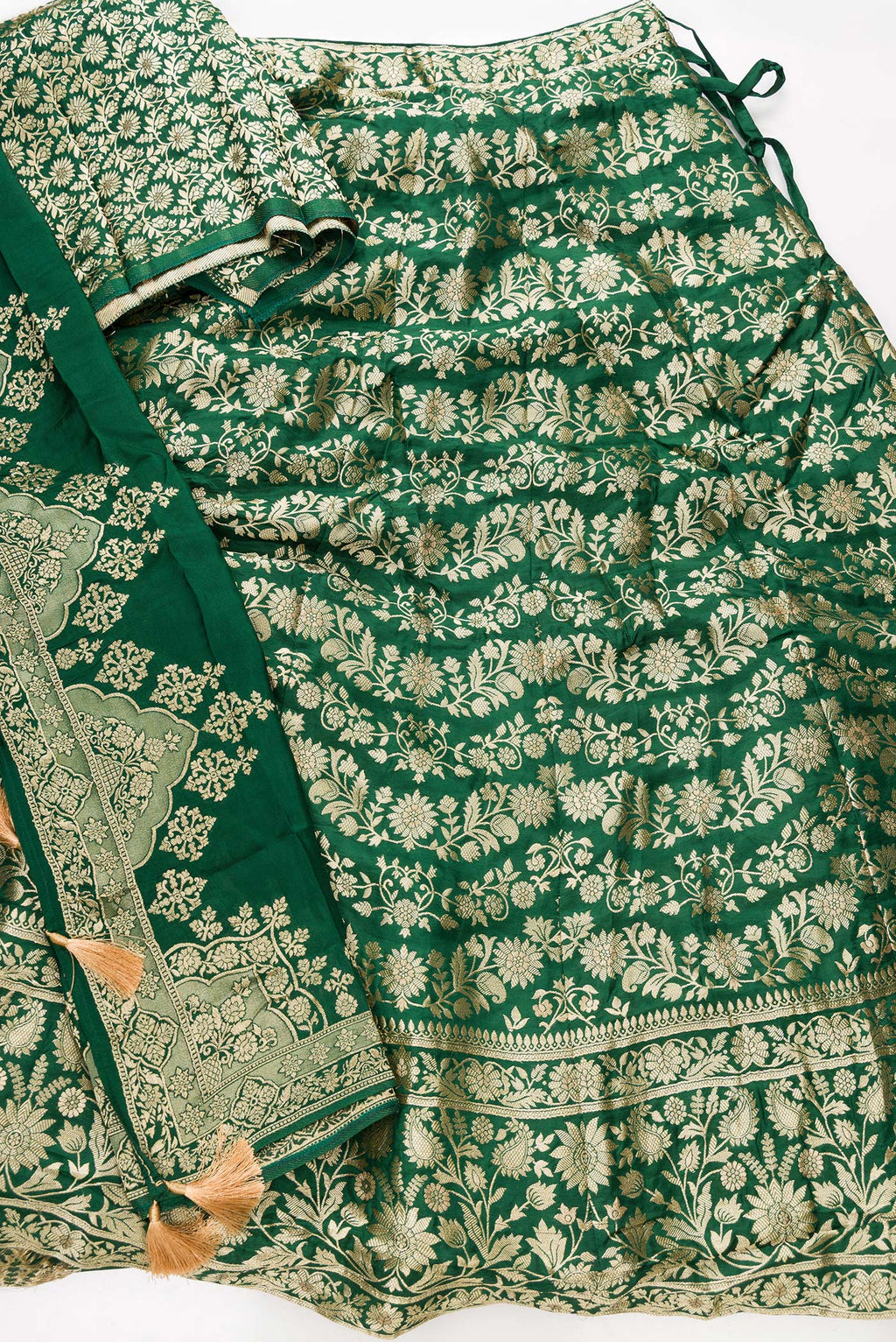 Flat lay of Green Banarasi Silk Womens Lehenga set featuring Zari Brocade Choli paired with Green Zari Brocade Skirt with Zari Border and a Zari Butta dupatta in Green