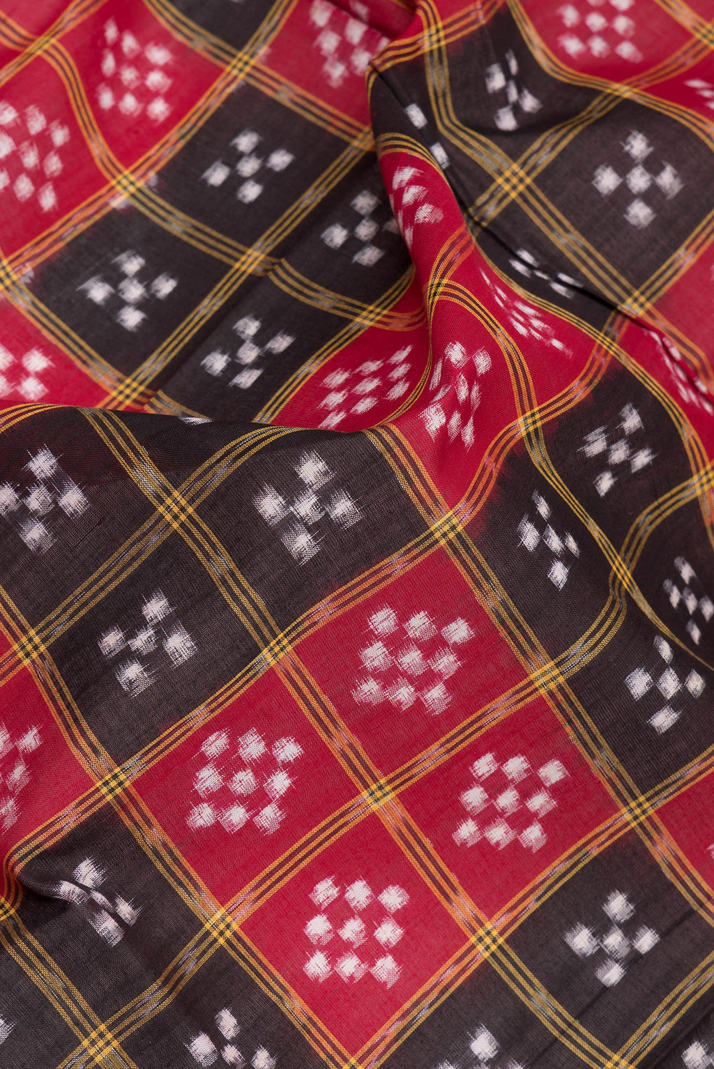Close up of Multi Color Double Ikat Saree with Printed design on the body and Thread Border.  displaying folds