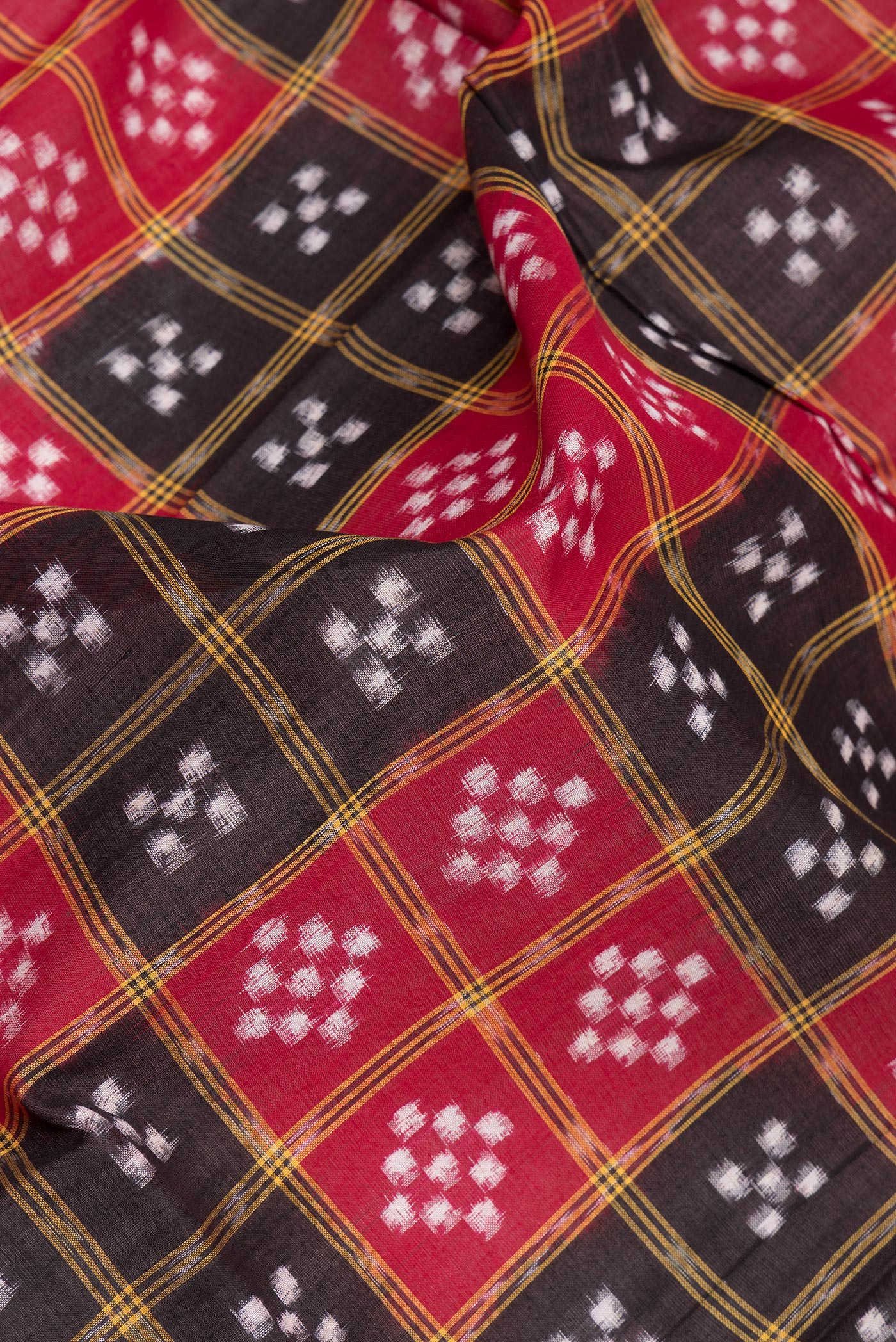 Close up of Multi Color Double Ikat Saree with Printed design on the body and Thread Border.  displaying folds