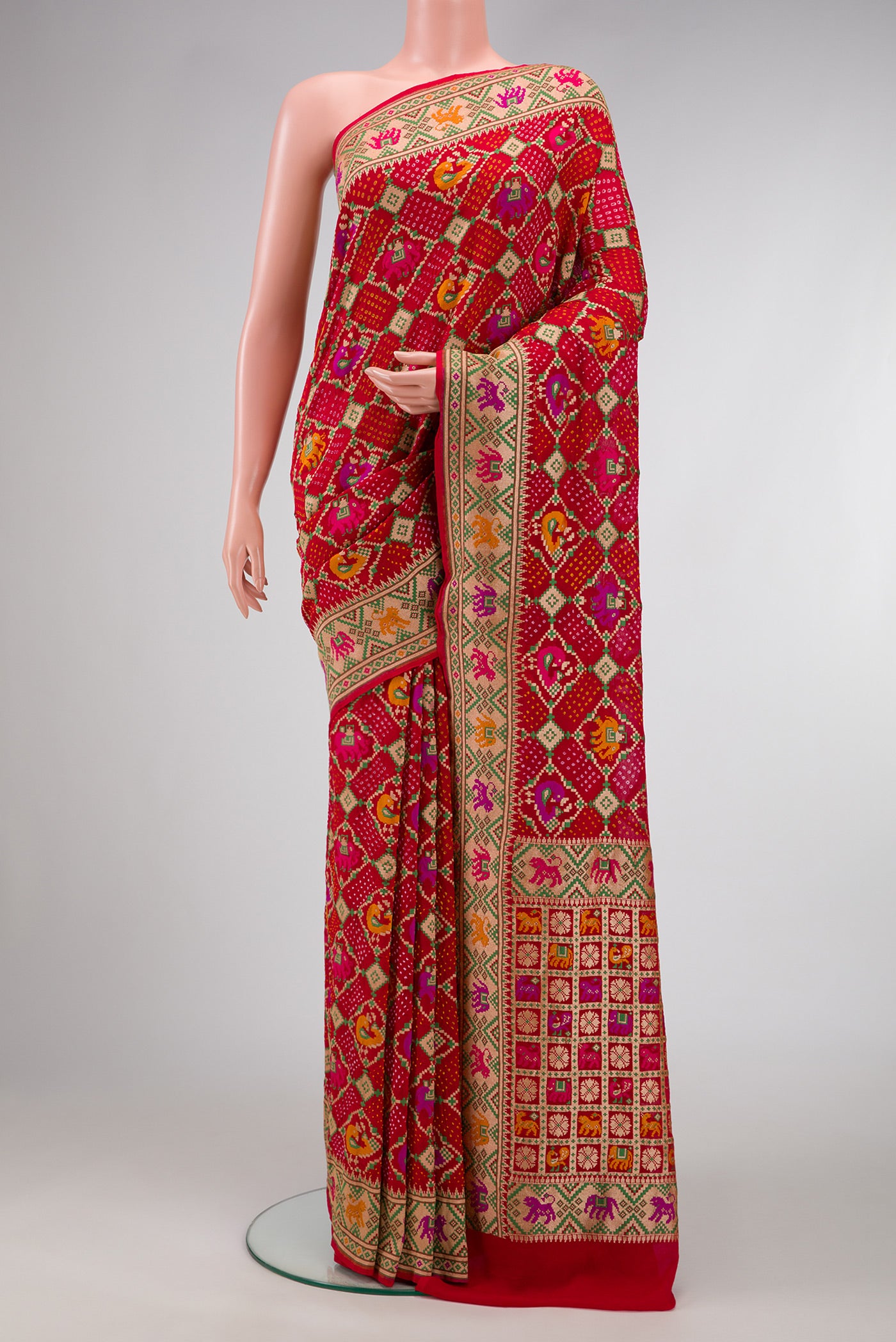 Red Dual Tone Banarasi Georgette Saree with Bandhani Print on the body and Fancy Border.  displayed on a mannequin