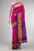 Pink Dual Tone Bandhani Silk Saree with Bandhani Print on the body and Ikat Border.  displayed on a mannequin