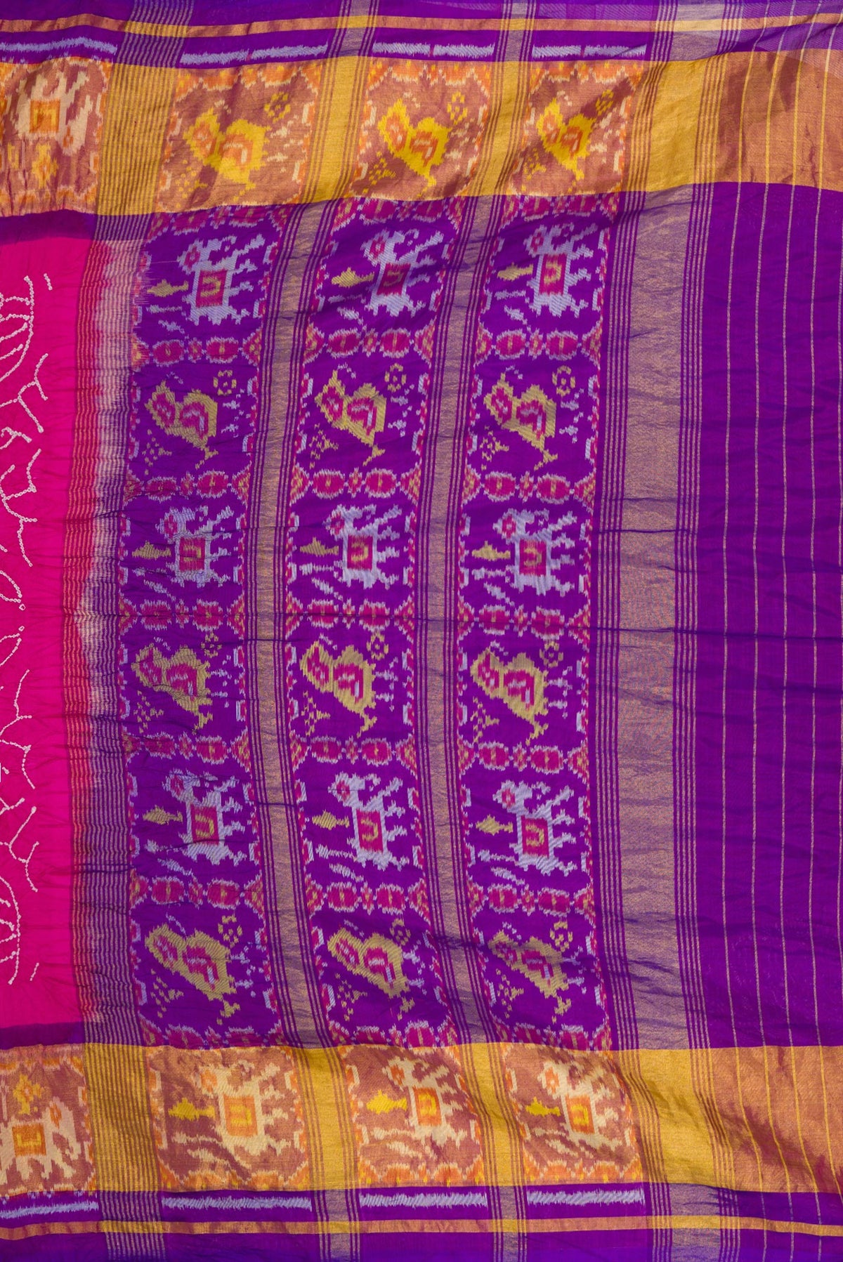 Close up image of the pallu of Pink Dual Tone Bandhani Silk Saree with Bandhani Print on the body and Ikat Border. 
