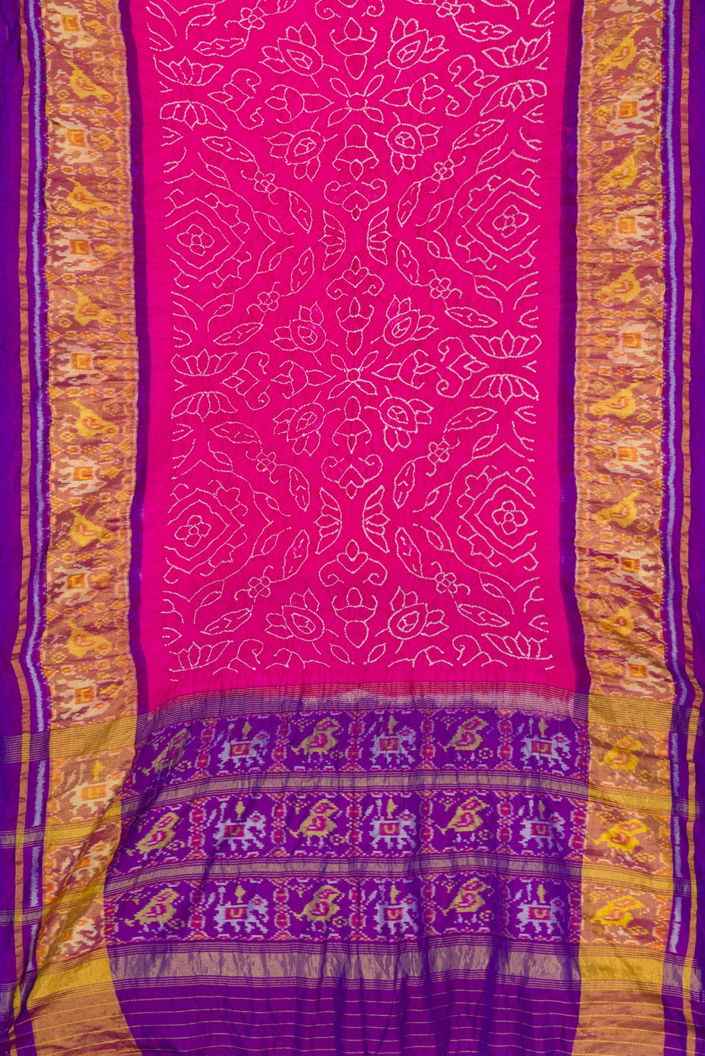 Flat view of Pink Dual Tone Bandhani Silk Saree with Bandhani Print on the body and Ikat Border. 