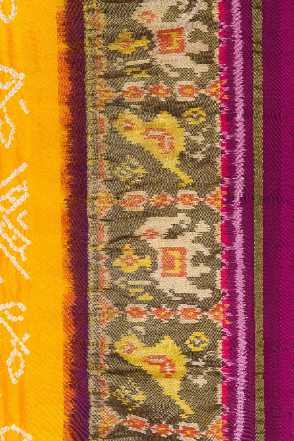 Border image of Yellow Dual Tone Bandhani Silk Saree with Bandhani Print on the body and Ikat Border. 