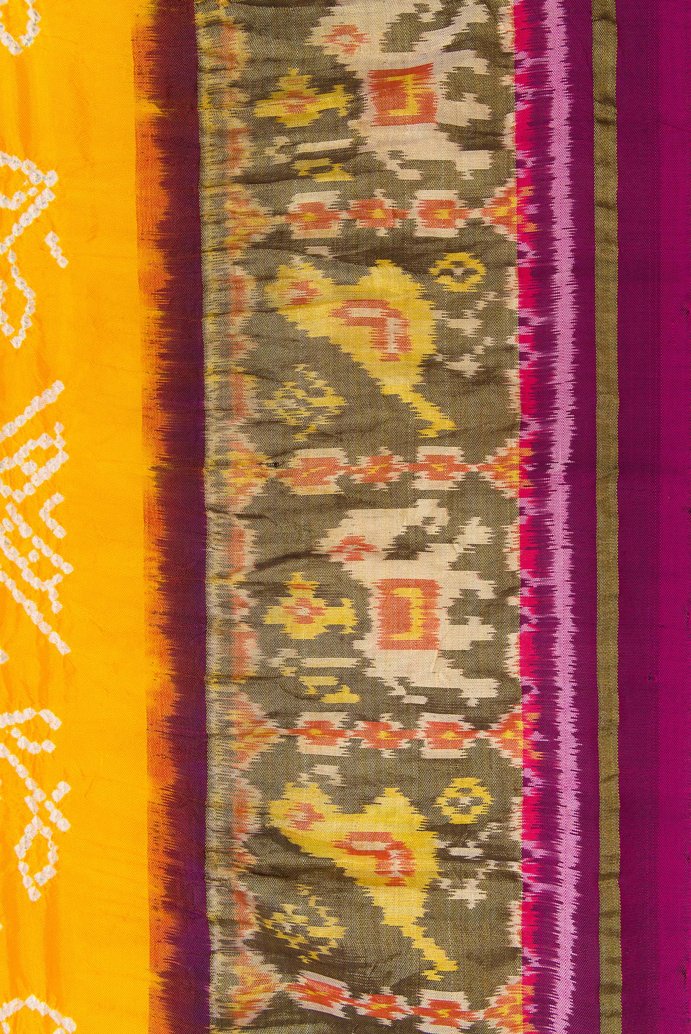 Border image of Yellow Dual Tone Bandhani Silk Saree with Bandhani Print on the body and Ikat Border. 