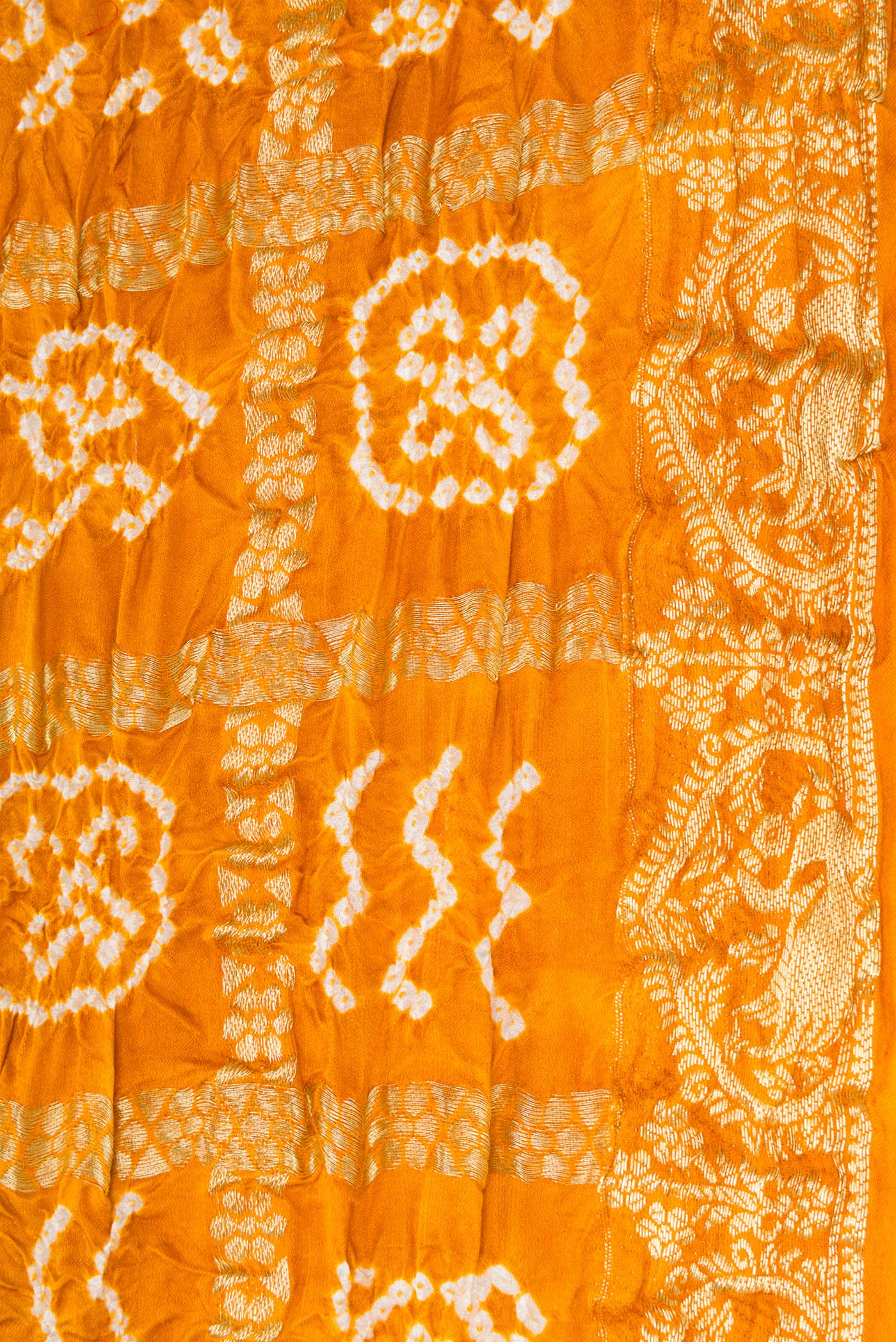 Border image of Mustard Dual Tone Bandhani Silk Saree with Bandhani Print on the body and Zari Border. 