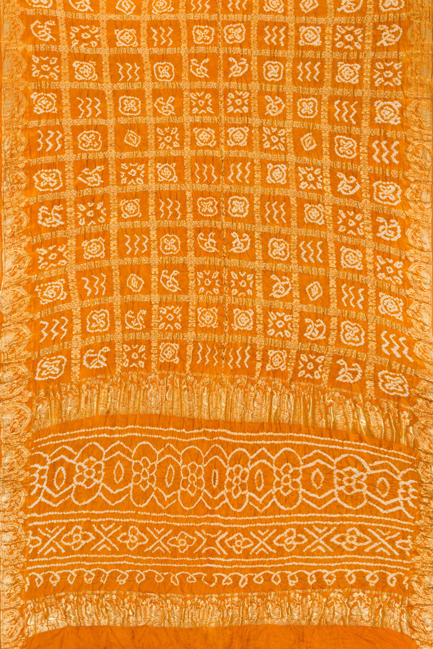 Flat view of Mustard Dual Tone Bandhani Silk Saree with Bandhani Print on the body and Zari Border. 