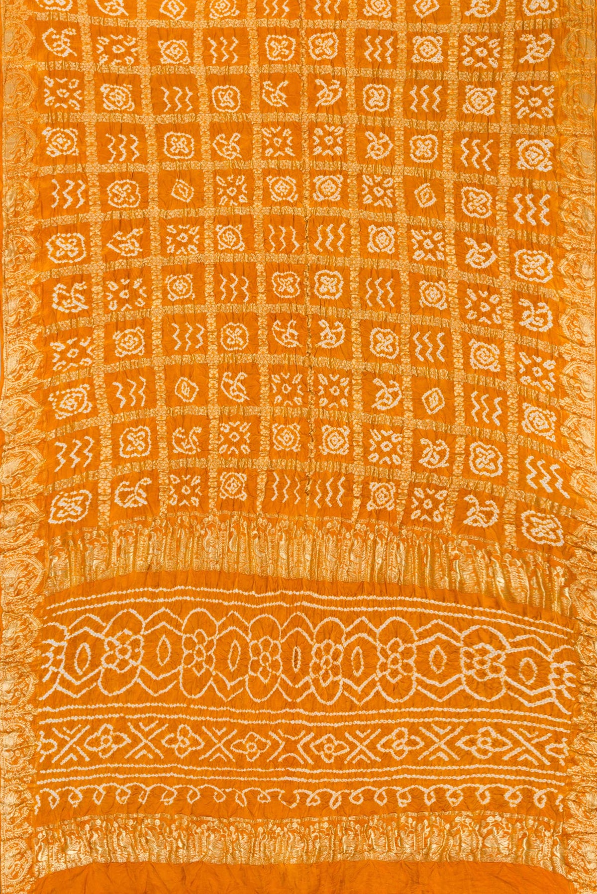 Flat view of Mustard Dual Tone Bandhani Silk Saree with Bandhani Print on the body and Zari Border. 