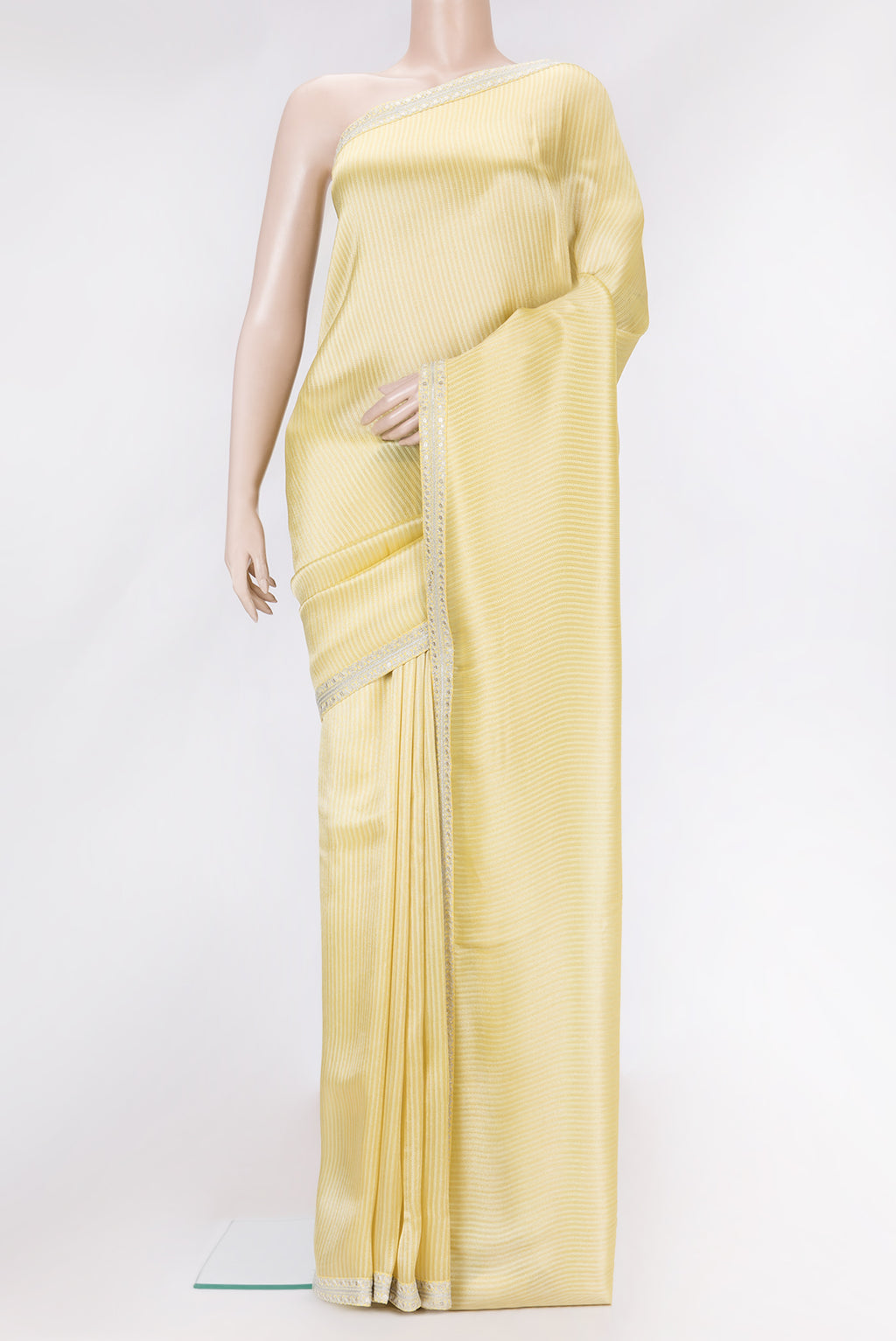 Yellow Dual Tone Mysore Georgette Saree with Zari Brocade on the body and Embroidery Border.  displayed on a mannequin