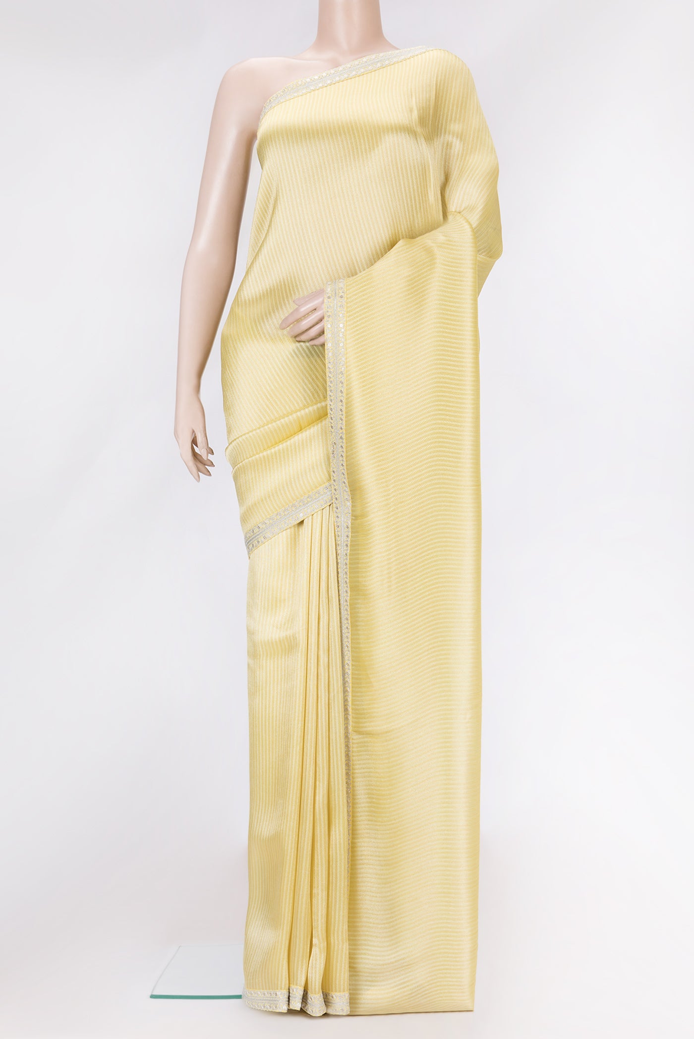 Yellow Dual Tone Mysore Georgette Saree with Zari Brocade on the body and Embroidery Border.  displayed on a mannequin