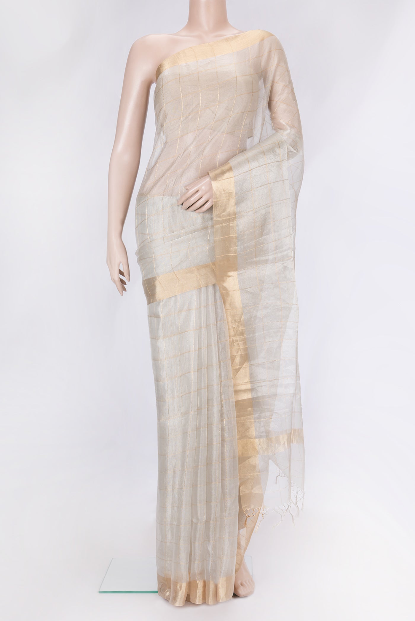 Silver Dual Tone Organza Silk Saree with Checked design on the body and Zari Border.  displayed on a mannequin