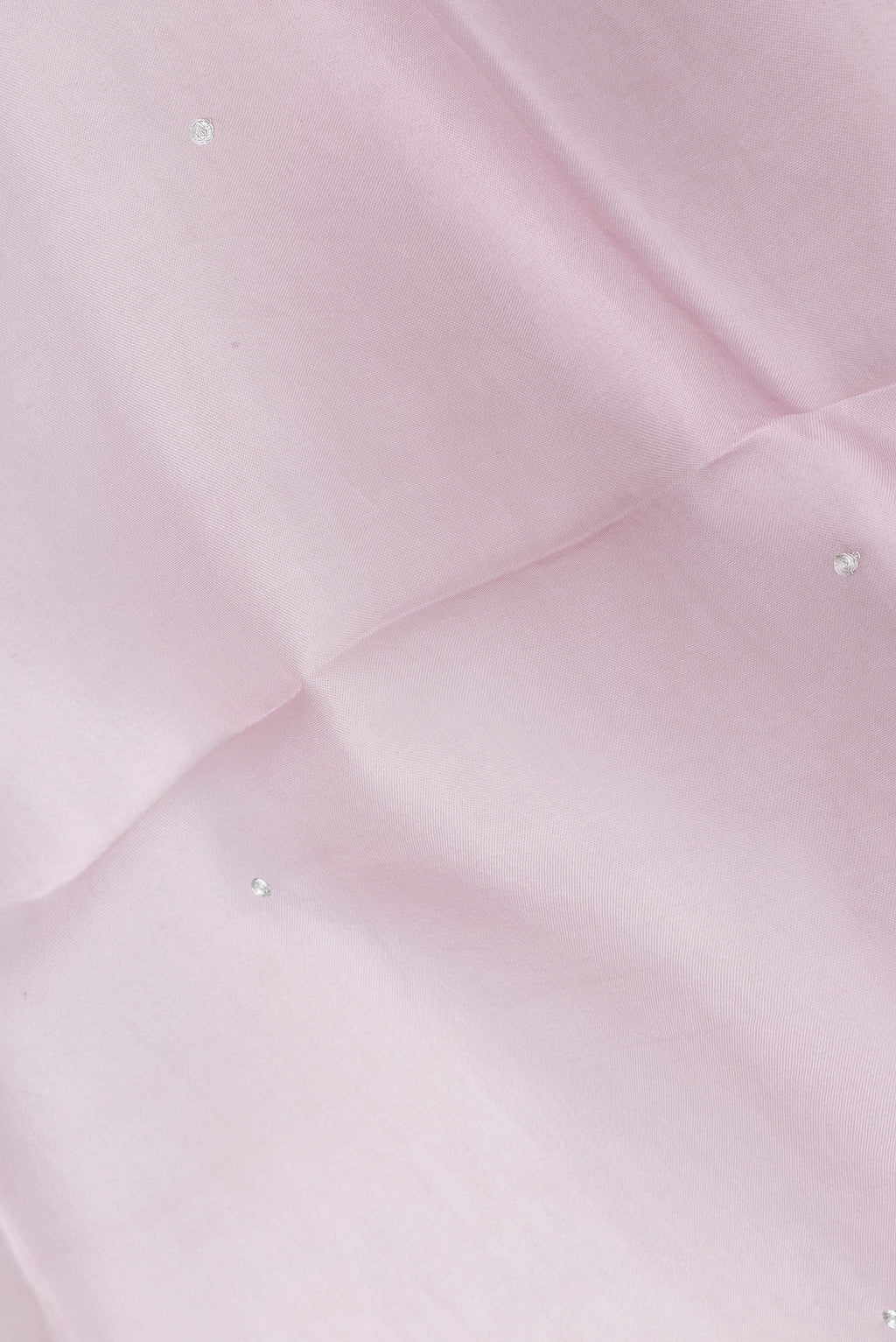 Close up of Rose pink Dual Tone Organza Silk Saree with Embroidery on the body and Embroidery Border.  displaying folds