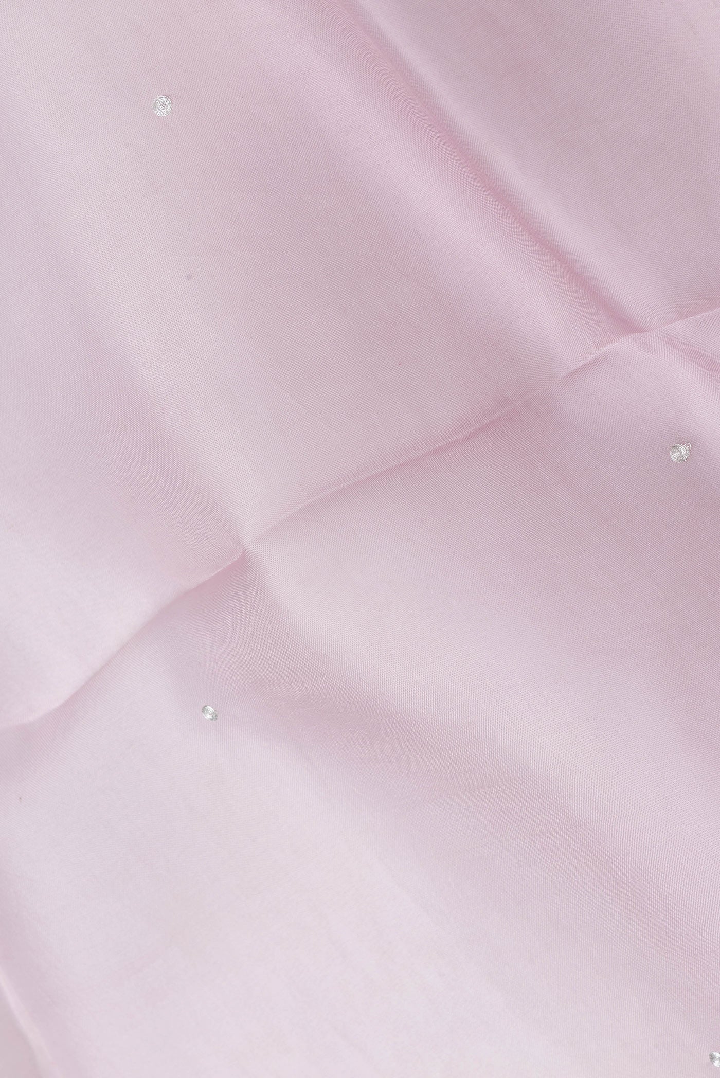 Close up of Rose pink Dual Tone Organza Silk Saree with Embroidery on the body and Embroidery Border.  displaying folds