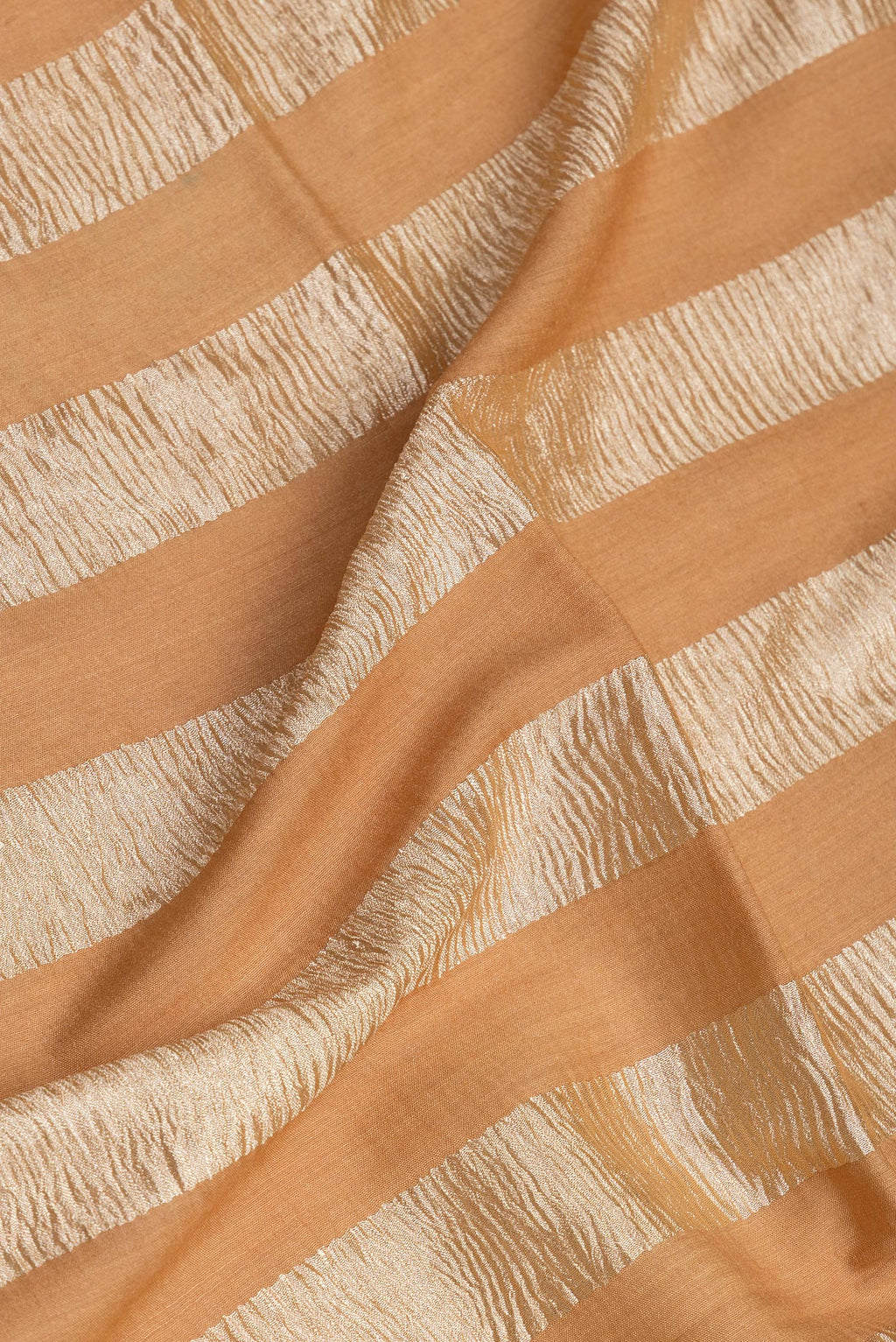 Close up of Sandal Tussar Silk Saree with Stripes on the body and Zari Border.  displaying folds