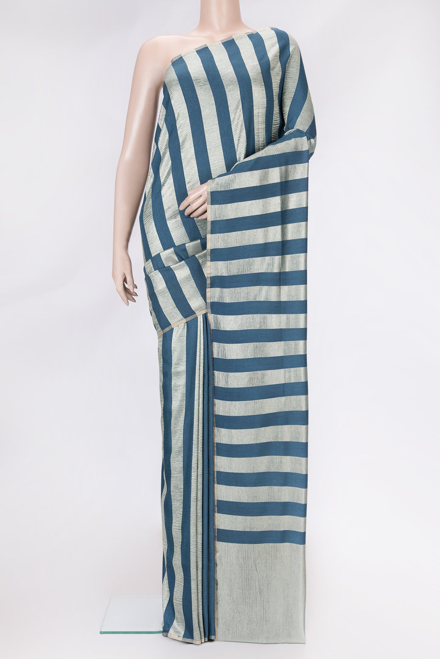 Peacock Blue Dual Tone Tussar Silk Saree with Stripes on the body and Zari Border.  displayed on a mannequin
