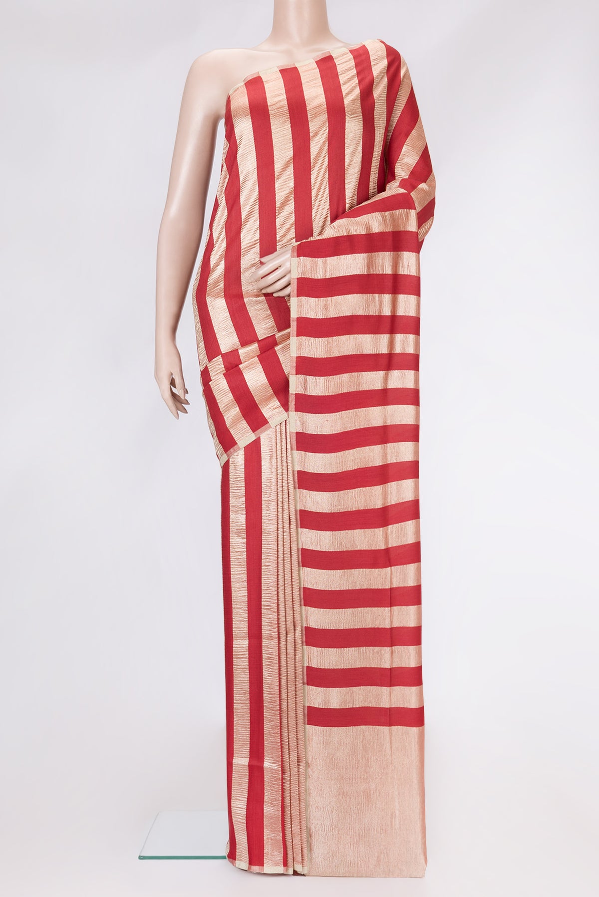 Red Dual Tone Tussar Silk Saree with Stripes on the body and Zari Border.  displayed on a mannequin